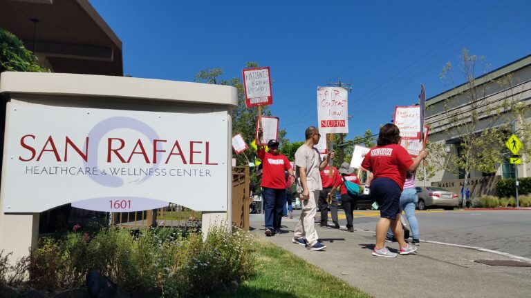 Caregivers picket Brius-owned home.